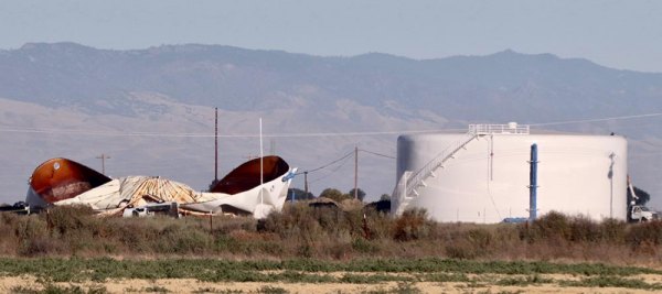 The damaged City of Lemoore water tank next to a second tank, which was not damaged in the explosion.